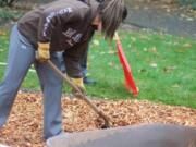 Cascade Highlands: Skyview student Hannah Johnson, front, and Cascade Highland neighborhood association chair Jean Kent help with improvements to Homestead Park.