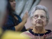 Zachary Kaufman/The ColumbianJean Buell, 83, claps to a beat under direction of cognitive trainer Debra Ochoa at Vancouver's Kamlu Retirement Inn.