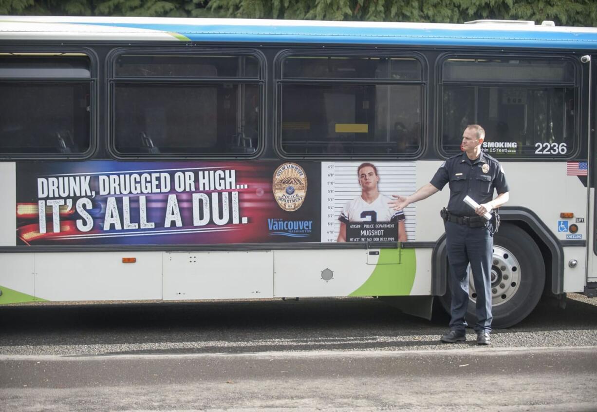 Lt. Steve Neal talks about an ad warning people not to drive drunk or high, as seen on the side of a C-Tran bus Thursday. The Vancouver Police Department received a $150,000 grant, most of which will go to extra patrols, from the state to combat impaired driving.