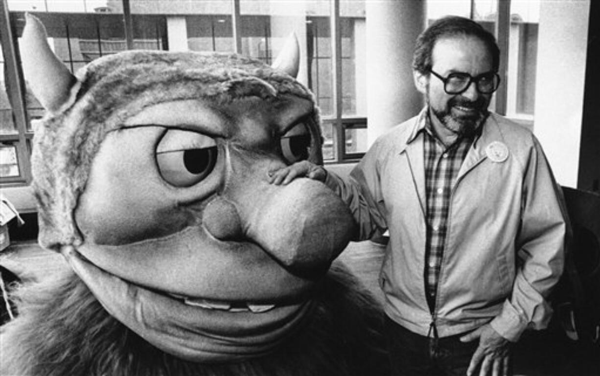 In this Sept. 25, 1985 file photo, author Maurice Sendak poses with one of the characters from his book &quot;Where the Wild Things Are,&quot; designed for the operatic adaptation of his book in St. Paul, Minn. Sendak died, Tuesday, May 8, 2012 at Danbury Hospital in Danbury, Conn.