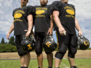 Josh Friedli, left, Mike Devera and Josh Ingebretson have dedicated themselves to Hudson's Bay football and hope the program takes off long after they are done playing.