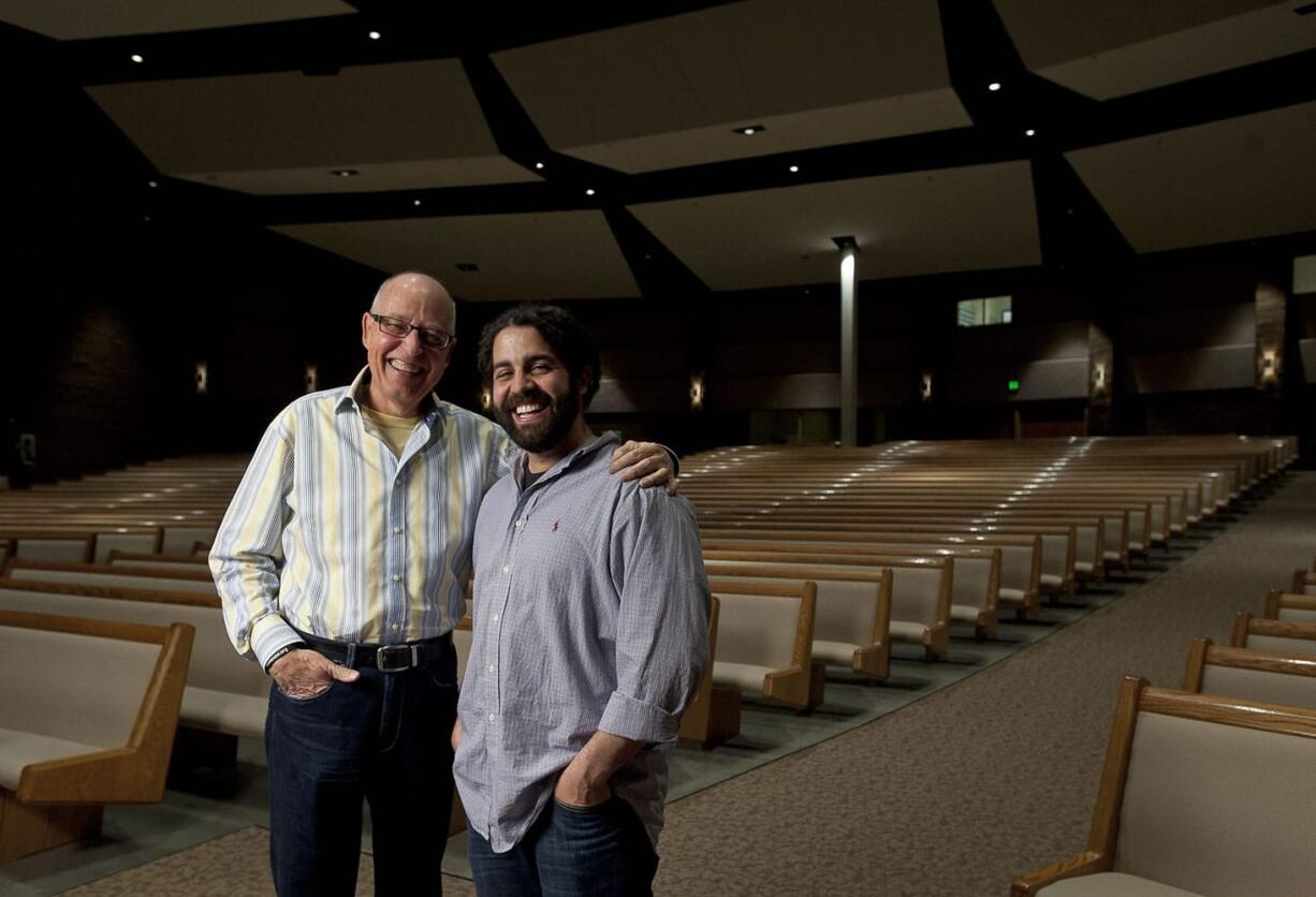 Crossroads Community Church pastors Bill Ritchie, left, and Daniel Fusco pose for a portrait inside the sanctuary.