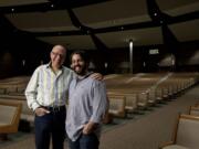 Crossroads Community Church pastors Bill Ritchie, left, and Daniel Fusco pose for a portrait inside the sanctuary.