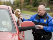 Ridgefield Police Officer Jason Ferriss makes a traffic stop while on patrol recently.