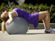 WEEK 8 SPRING TRAINING CYCLING n STRETCH OVER THE BALL n Sherri McMillan demonstrates exercises you can do outdoors as part of an eight-week fitness program.