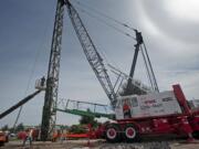 As part of the Columbia River Crossing, workers carry out pile driving and shaft drilling on the Oregon side of the river.