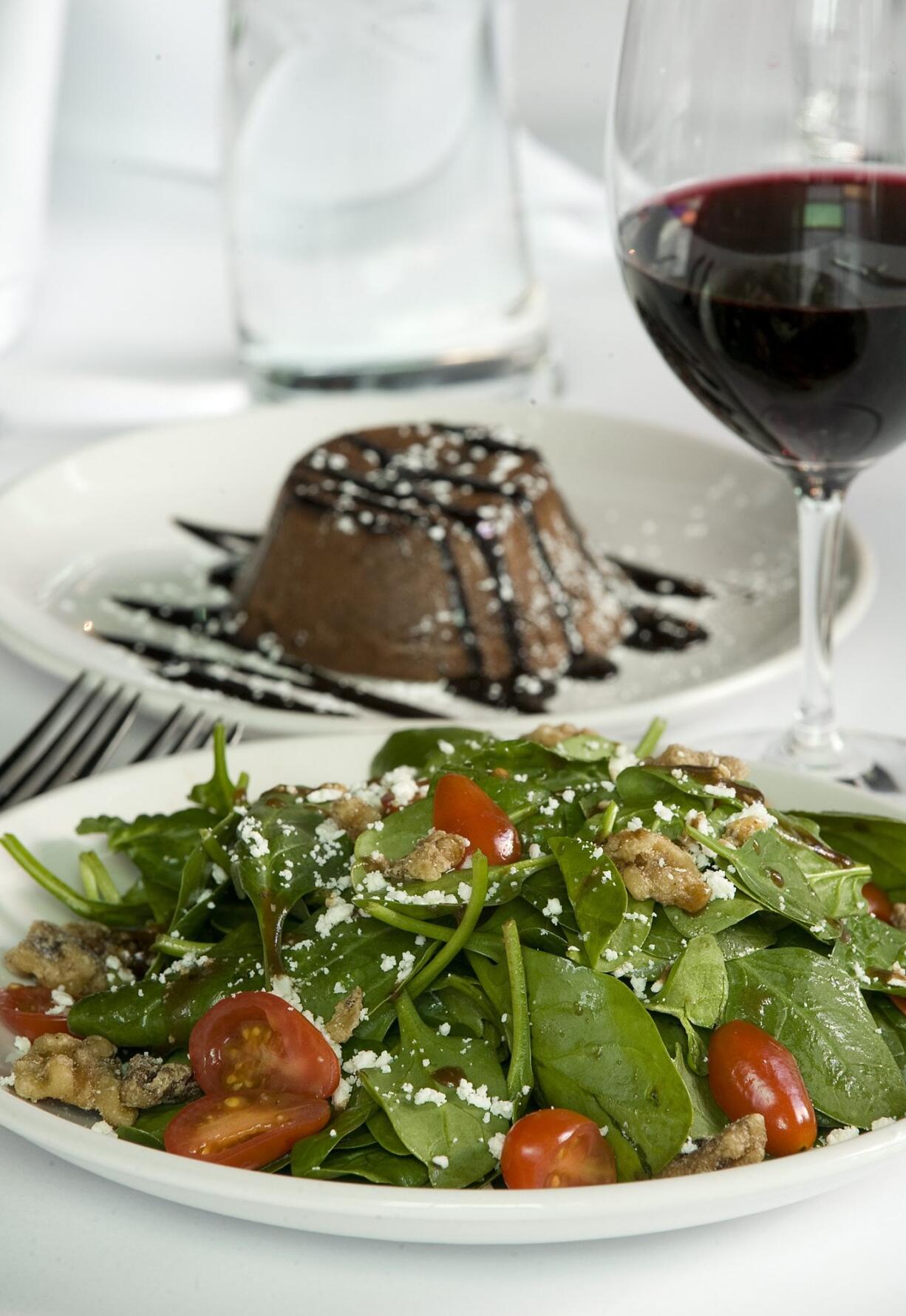 Spinach Salad with candied walnuts and goat cheese and Chocolate Lava cake are among the offerings in the living room theaters at Cinetopia.