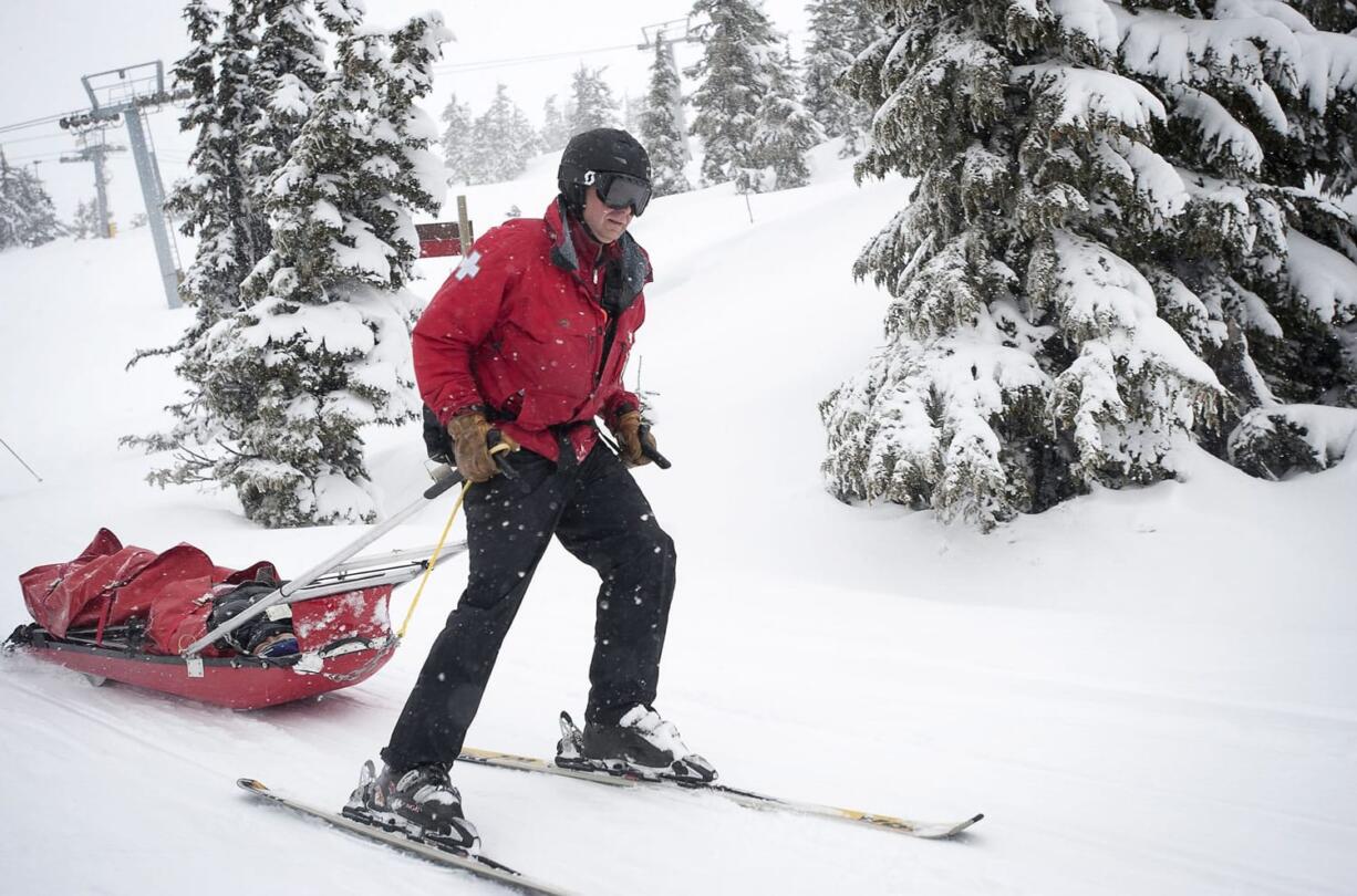 Clark County Superior Court Judge Scott Collier pulls a sled with a patient onboard while working ski patrol at Timberline Lodge in Oregon on March 31.