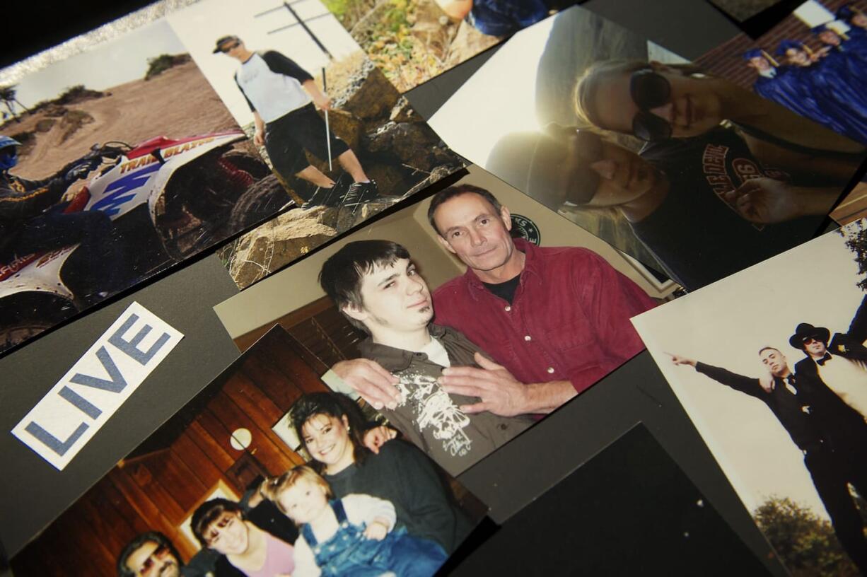 Terry Hurd, right, the father of 24-year-old Adam Hurd, is pictured here with his son on a poster board filled with photographic memories. Adam Hurd struggled with a two-year heroin addiction before dying of a drug overdose on Aug.