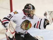 Portland Winterhawks goaltender Mac Carruth makes a save against the Kamloops Blazers during Game 7 of their WHL Western Conference semifinal series Wednesday at Memorial Coliseum in Portland.