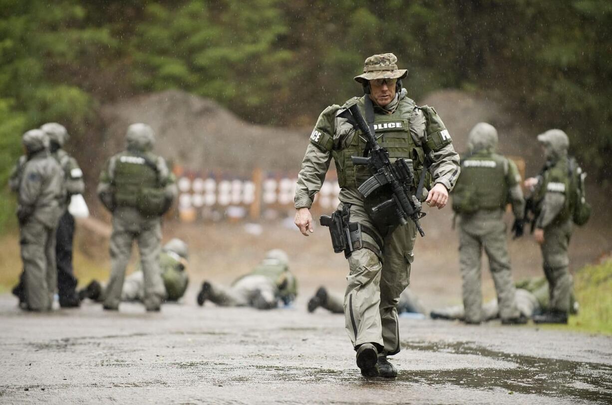 The Southwest Washington SWAT team, including Rick Kelly of the Battle Ground Police Department, trains at the English Pit Shooting Range last week.