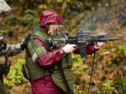 Columbian reporter Andrea Damewood experiences a Colt M4 Commando firsthand as the Southwest Washington SWAT team trains at the English Pit Shooting Range last week.