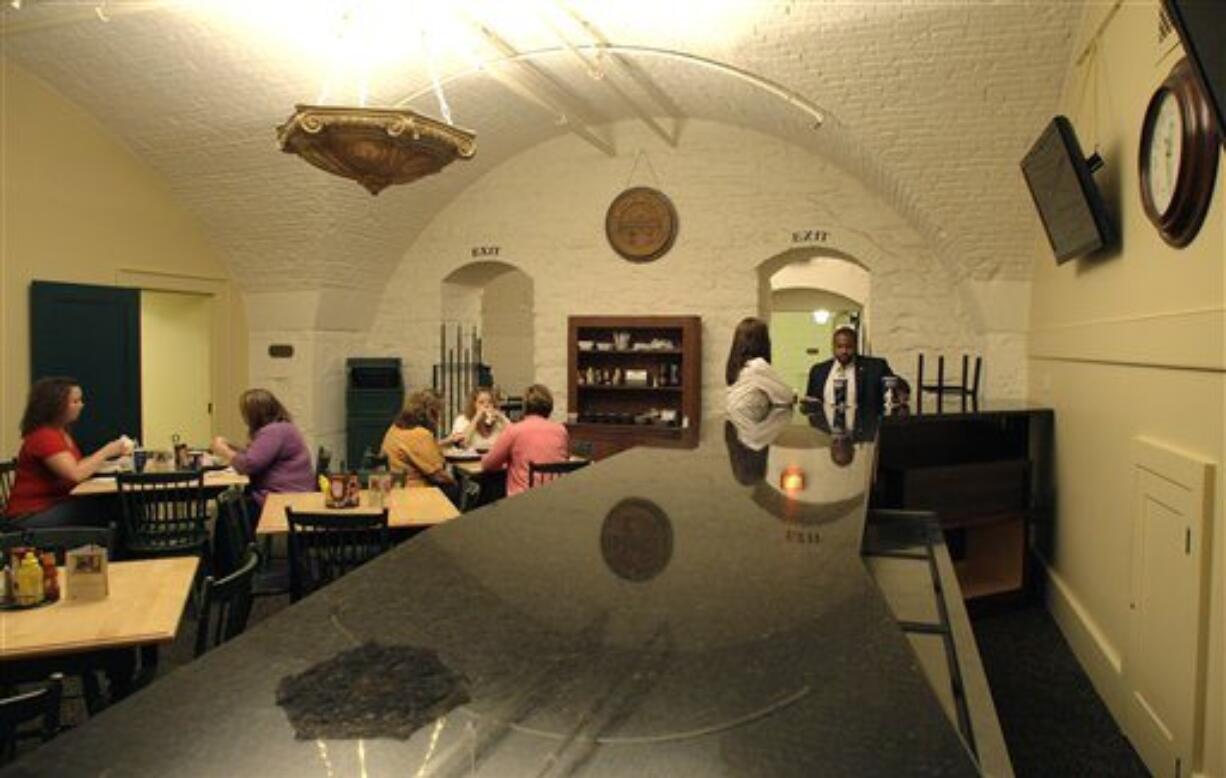 Patrons eat lunch in the dining room of the Statehouse cafe where a new counter top was installed Monday, Aug. 1, 2011, in Columbus, Ohio. State officials are debating a proposal to establish what would apparently be the nation's first statehouse bar.