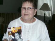 Minnehaha: Gwen Davis shows the book &quot;Left Alive to Die&quot; written about her brother, Navy Capt. Harley Hall.