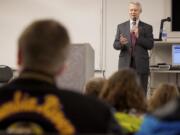 Secretary of State Sam Reed tells Columbia River High School students about the excitement he saw in youths when he observed elections in Russia and Uganda.