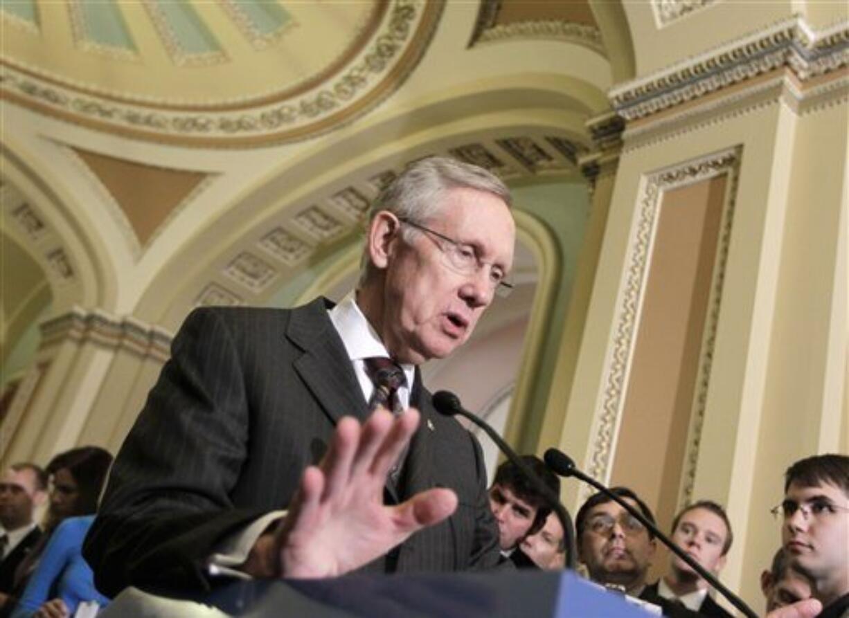 In this Oct. 4, 2011, photo, Senate Majority Leader Harry Reid meets with reporters on Capitol Hill in Washington. Facing fierce congressional resistance, the administration has accepted restrictions on detention of terror suspects. Last year's defense bill and the omnibus spending bill that Obama and Congress agreed to in April barred the transfer of terror suspects from Guantanamo to the United States, prevented construction or modification of U.S. facilities to house suspects, and required the defense secretary to notify Congress before moving a terror suspect to a foreign country. Now, however, the administration is pushing back by opposing detainee provisions in the latest defense bill. And, citing administration opposition as well as his own reservations, Reid said he would hold up the bill until concerns over the detainee provisions are settled.(AP Photo/J.