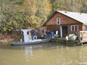 Clark County Sheriff's Office Employees of McCuddy's Ridgefield Marina helped secure an abandoned floating home that had broken loose from the east bank of the Lake River late last month.