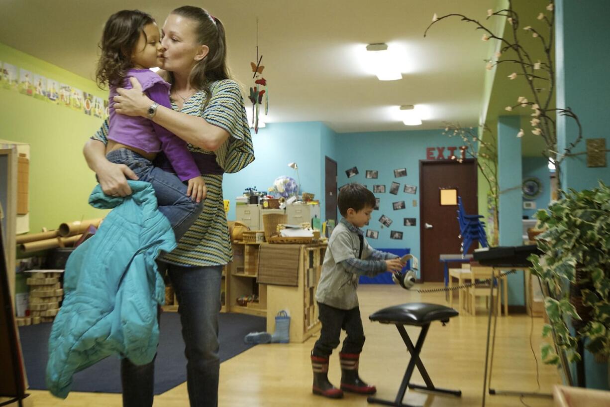 Rachel Collins picks up her daughter, 4-year-old Alexis, at Y's Care, the on-site child care program run by the YWCA Clark County. Y's care is affordable to low-income families and allows single moms, such as Collins, to work.