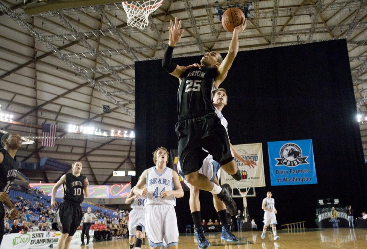 Union's Jordan Chatman drives to the rim against Central Valley at the 4A Boys State Basketball Tournament in Tacoma, Friday, March 2, 2012.(Steven Lane/The Columbian)