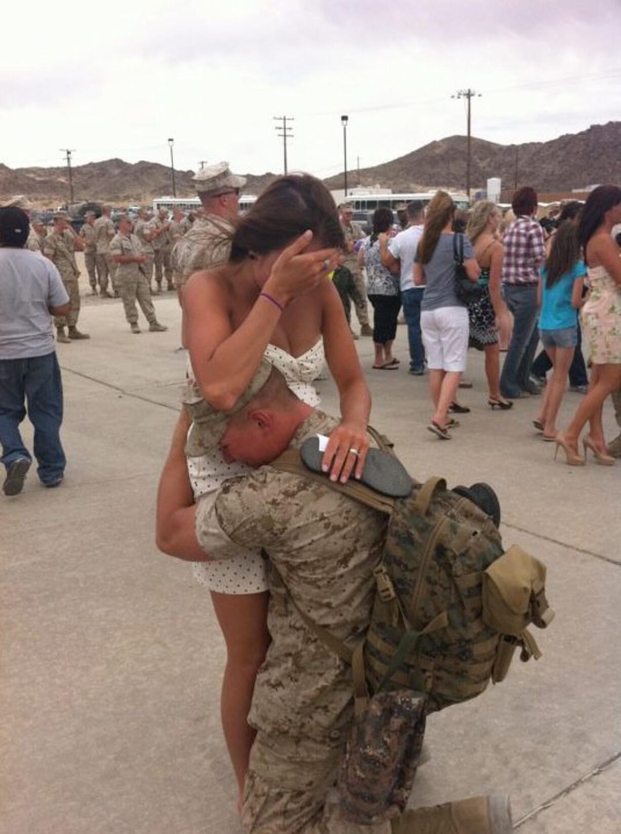 Orchards: On June 1, when Marine Cpl. Cody Morrison returned from Afghanistan to Twentynine Palms Base in San Bernardino County, Calif., his wife, Tiffany, was there to greet him -- along with their unborn child. Their friend Brittany Hout snapped this dramatic and emotional photo of their reunion. &quot;There is so much sacrifice and loss in these wars. I really felt this picture shows all that and yet all the joy that emerges from all the sacrifice,&quot; Cody's mother, Kari Morrison, said at the time. (Tiffany is gripping a sandal in one hand because it fell off her foot during her race to greet Cody). We're pleased to report that Cody and Tiffany are doing fine, and so is baby Cali Rose Morrison, born July 13. Cody is a graduate of Heritage High School and Tiffany a graduate of Camas High School; they live in California now but Kari, &quot;their local anchor,&quot; lives in Orchards. &quot;Cody will be discharged from the Marine Corps on April 15, 2012,&quot; Kari told us earlier this month.