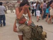 Orchards: On June 1, when Marine Cpl. Cody Morrison returned from Afghanistan to Twentynine Palms Base in San Bernardino County, Calif., his wife, Tiffany, was there to greet him -- along with their unborn child. Their friend Brittany Hout snapped this dramatic and emotional photo of their reunion. &quot;There is so much sacrifice and loss in these wars. I really felt this picture shows all that and yet all the joy that emerges from all the sacrifice,&quot; Cody's mother, Kari Morrison, said at the time. (Tiffany is gripping a sandal in one hand because it fell off her foot during her race to greet Cody). We're pleased to report that Cody and Tiffany are doing fine, and so is baby Cali Rose Morrison, born July 13. Cody is a graduate of Heritage High School and Tiffany a graduate of Camas High School; they live in California now but Kari, &quot;their local anchor,&quot; lives in Orchards. &quot;Cody will be discharged from the Marine Corps on April 15, 2012,&quot; Kari told us earlier this month.