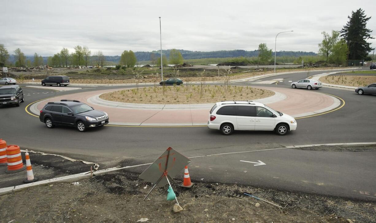 Cars navigate one of the new roundabouts that are part of the Highway 14 widening project in Camas and Washougal.