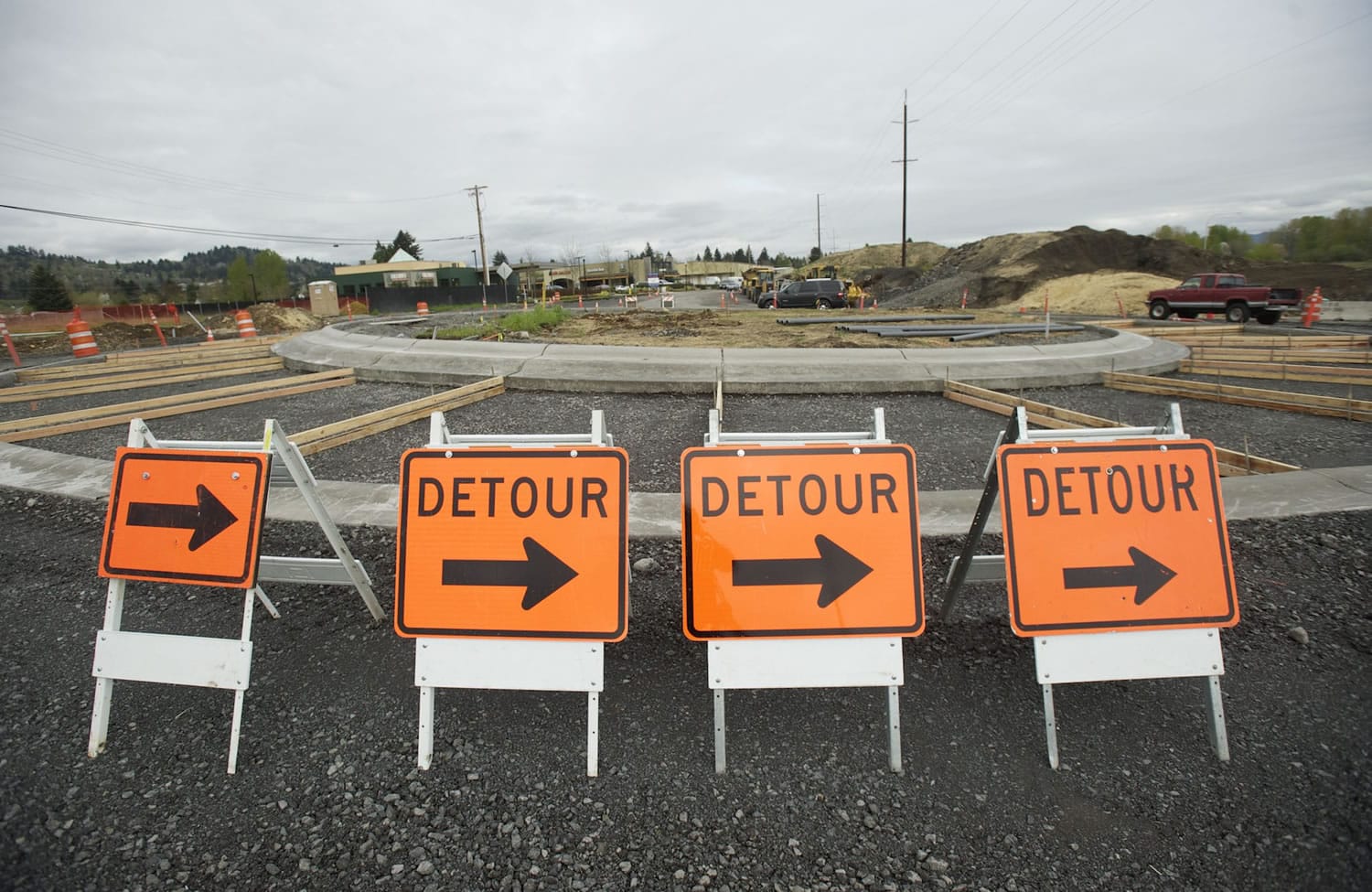 Cars navigate a new roundabout on Hwy.