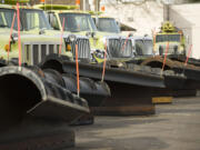 The Washington State Department of Transportation keeps a fleet of trucks and snow plows ready for action throughout the winter at its Vancouver maintenance facility. Forecasters expect low-elevation snow to fall across the region this weekend, with the first chance of flakes arriving Saturday night.