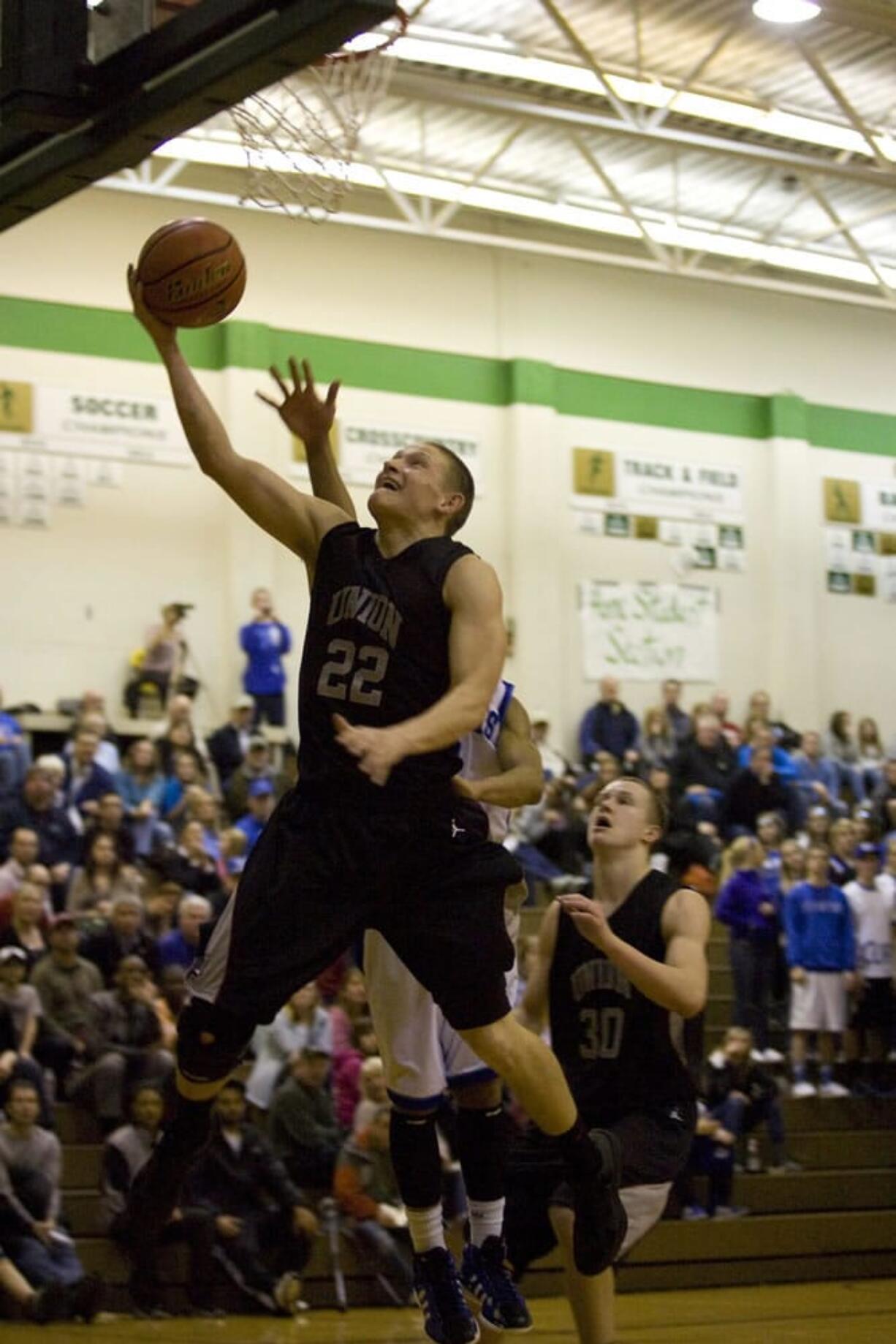 Union's Tanner Nelson goes to the basket against Curtis of Tacoma as the Titans advance to the state quarterfinals.