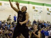 Union's Tanner Nelson goes to the basket against Curtis of Tacoma as the Titans advance to the state quarterfinals.