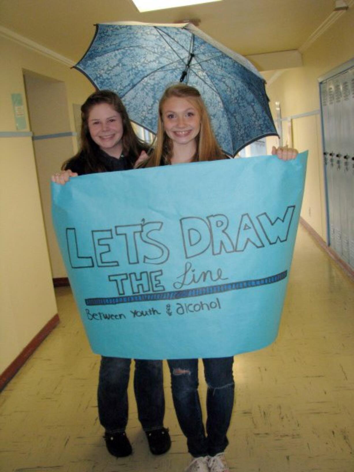 Stevenson: Annie Leighton, president, and Kayla Davis, vice president of Minors Against Substance abuse Habits, prepare to march to the courthouse.