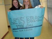 Stevenson: Annie Leighton, president, and Kayla Davis, vice president of Minors Against Substance abuse Habits, prepare to march to the courthouse.