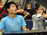 Pianist Fred Lu rehearses Beethoven's &quot;Emperor Concerto&quot; ahead of his Saturday solo at the Arlene Schnitzer Concert Hall in Portland.