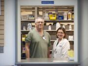 Pharmacist Mike Strickland, left, and Dr. Susan Davis have volunteered at the Free Clinic of Southwest Washington for the last 25 years, making them two of the longest-serving volunteers at the clinic in Vancouver.