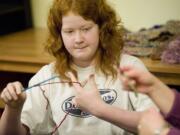 Torrey Hair, 11, who has learned to knit at the East Park Impact Center, said she is &quot;most definitely&quot; coming back next school year, she said.