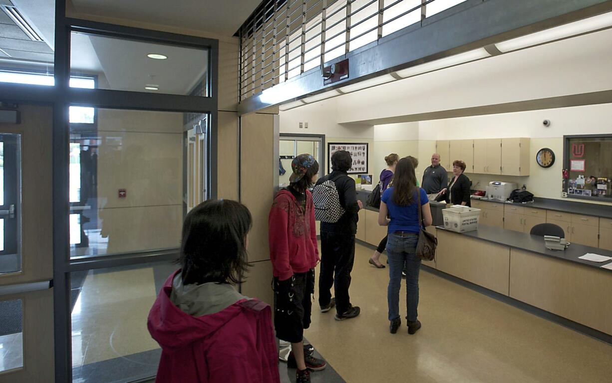 Students and visitors wait to speak with a secretary in Union High's main office Monday.