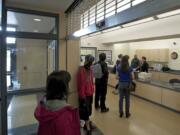 Students and visitors wait to speak with a secretary in Union High's main office Monday.