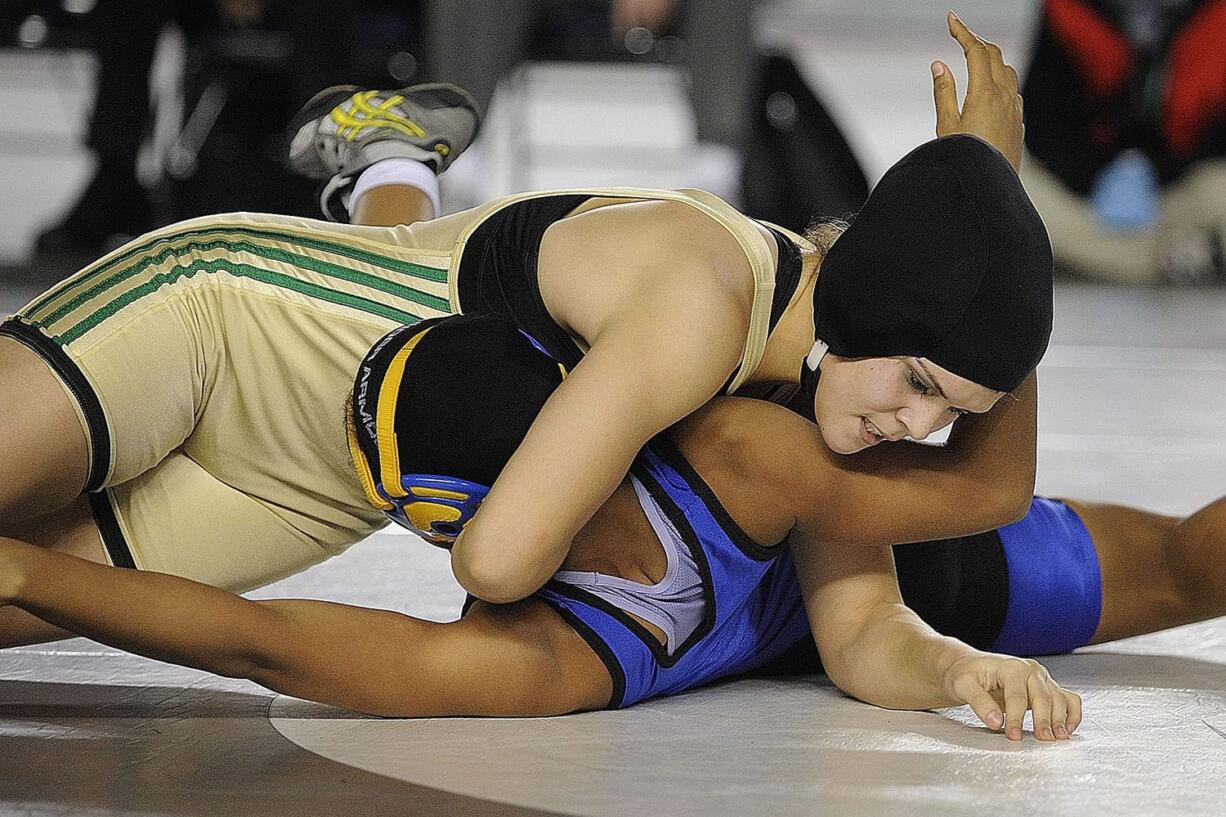 Stephanie Simon of Evergreen High School pins Lateah Holmes of Fife High School to win the 145-pound girls state title.