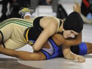 Stephanie Simon of Evergreen High School pins Lateah Holmes of Fife High School to win the 145-pound girls state title.