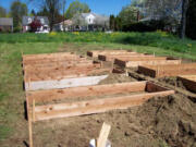 Arnada: Volunteers have spent several weekends breaking ground for the Arnada community garden and building these raised boxes, which soon will be filled with soil and planted with veggies and flowers.