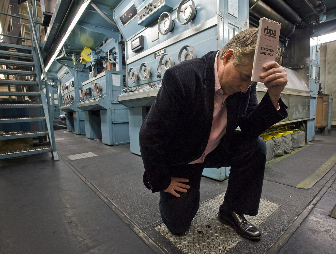 Columbian Editor Lou Brancaccio Tebows in the newspaper's pressroom  Wednesday.