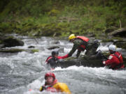 The Region 4 Technical Rescue team conducts water rescue drills at Big Eddy on the Washougal River on April 27.