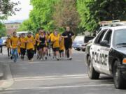 Local Special Olympics athletes and police escorts ran a torch from downtown Vancouver to the sheriff's office West Precinct near the Clark County Fairgrounds Wednesday morning.