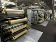 Wool yarn is carded at the Pendleton Woolen Mills.