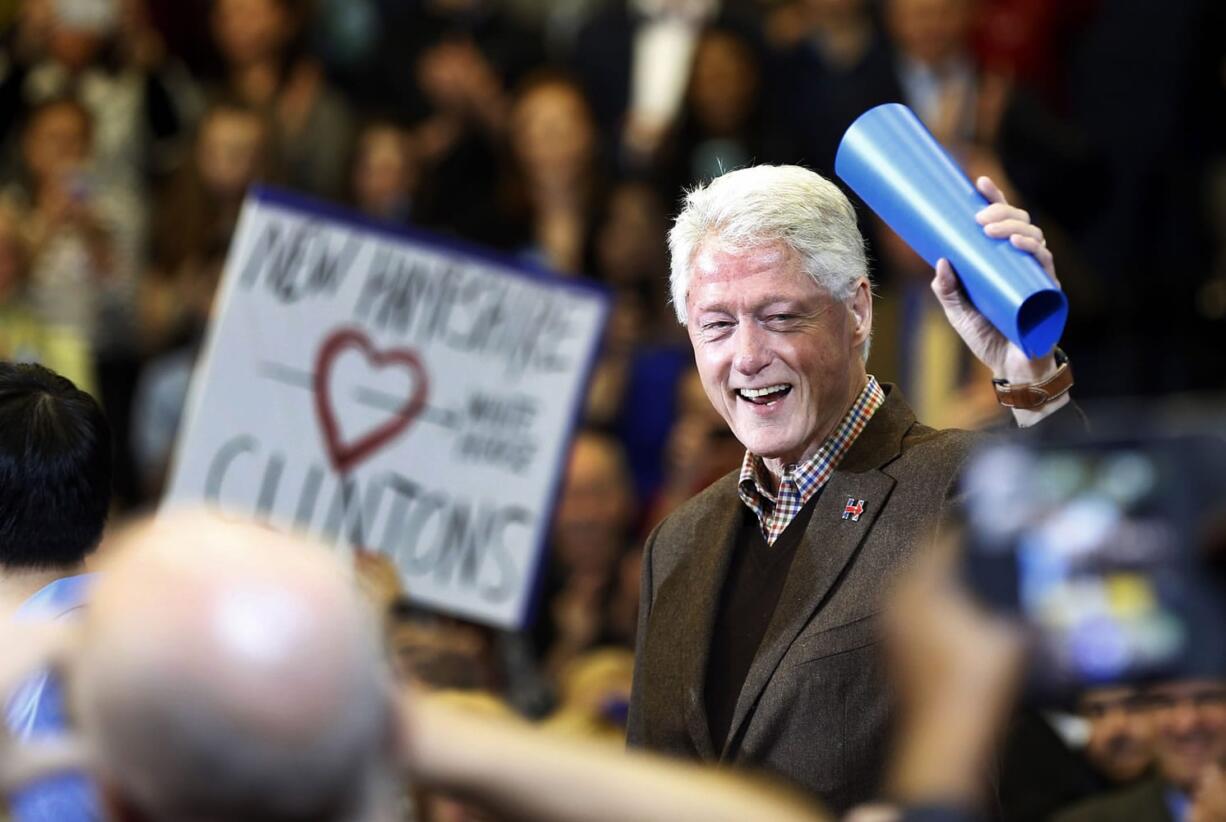 Former President Bill Clinton waves to a cheering crowd as he arrives during a campaign stop for his wife, Democratic presidential candidate Hillary Clinton, in January in Nashua, N.H.