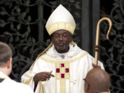 Episcopal Church Presiding Bishop-elect Michael Curry speaks to churchgoers Nov. 1 as he arrives at the Washington National Cathedral in Washington. Curry said Friday the U.S. Episcopal Church will not roll back its acceptance of gay marriage despite sanctions imposed this week by Anglican leaders.