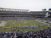 The San Diego Chargers play the Oakland Raiders during an NFL football game at Qualcomm Stadium in San Diego. Chargers Chairman Dean Spanos said Friday, Jan. 29, that the team will play in San Diego in 2016, and he&#039;ll work with politicians and the business community to try to resolve a long, bitter fight over a new stadium.