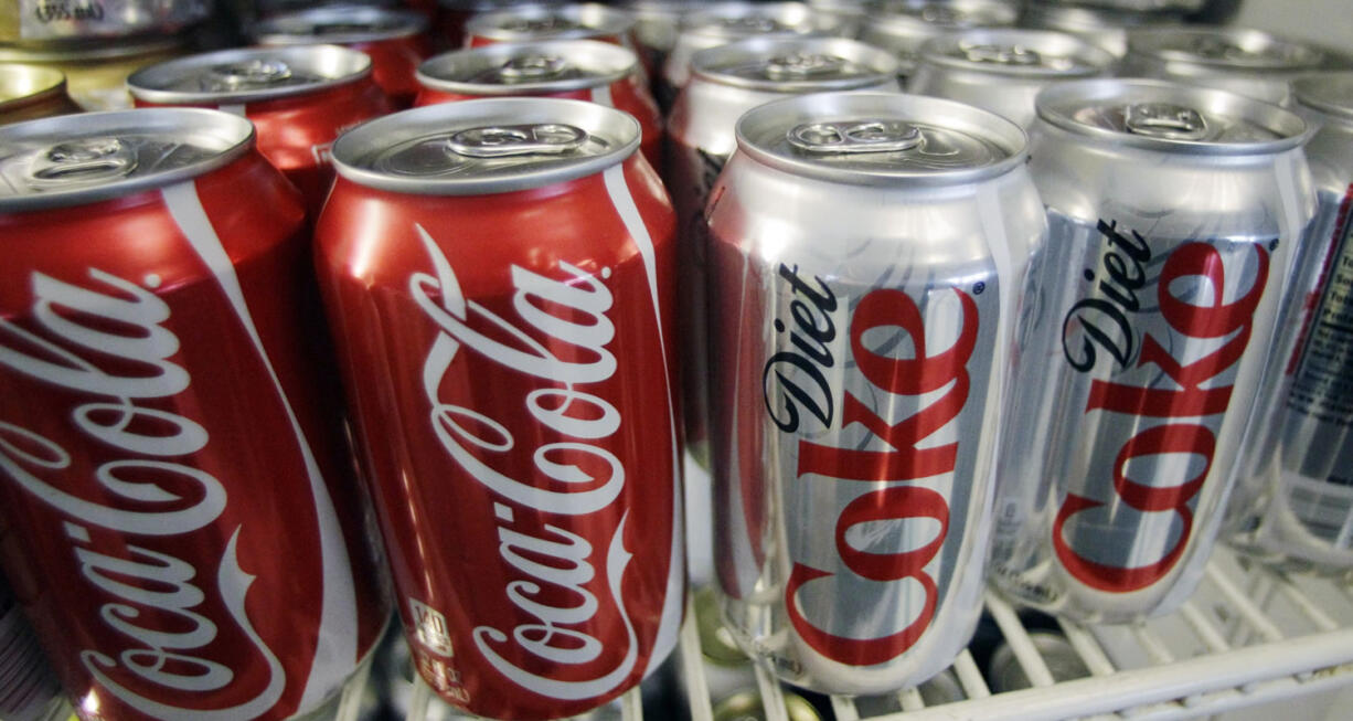 Cans of Coca-Cola and Diet Coke sit in a cooler in Anne&#039;s Deli in Portland.