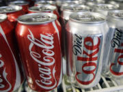 Cans of Coca-Cola and Diet Coke sit in a cooler in Anne&#039;s Deli in Portland.