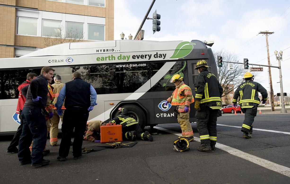 Police, firefighters and paramedics respond to a fatal accident involving a pedestrian and a C-Tran bus at the intersection of 8th Street and Washington Street in downtown Vancouver.